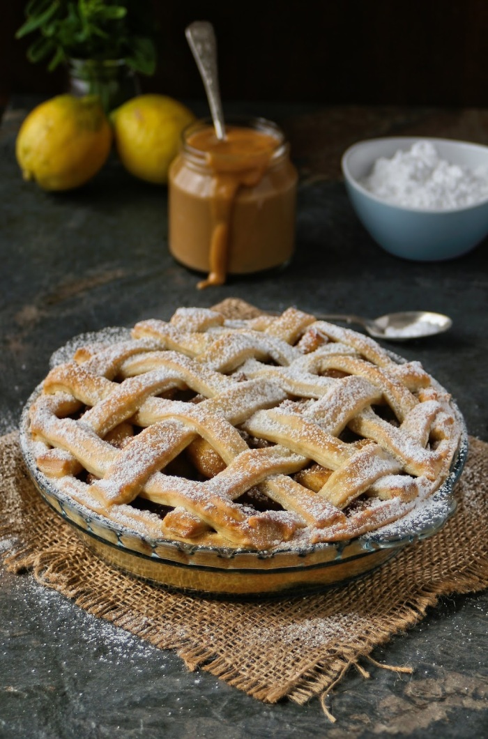 Apple pie with lattice crust and creamy caramel custard. 